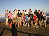 Galapagos 6-2-20 Bartolome Charlotte Ryan, Peter Ryan, Jerome Ryan And Our Team From The Top Of The Spatter Cone Charlotte Ryan, Peter Ryan, Jerome Ryan and the rest of our team pose at the summit of Bartolome in the Galapagos Islands at sunset. Our Naturalist Guide, Johnny Romero, is also in the picture  well, at least his shadow is.